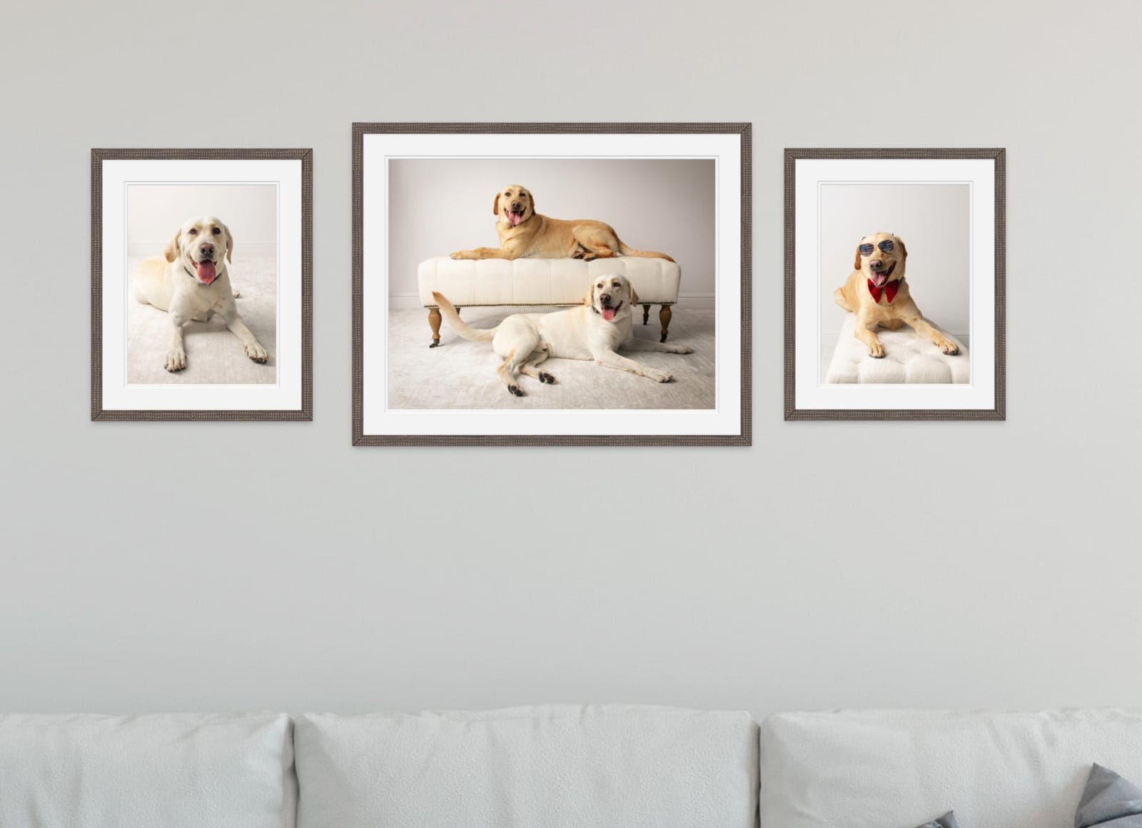 Custom-framed portrait prints displayed together on a wall